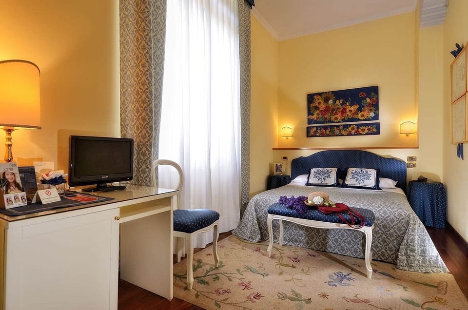 Deluxe Double or Twin Room | Minibar, in-room safe, desk, blackout drapes