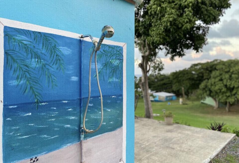 Shared outdoor shower located at the end of Longhouse!