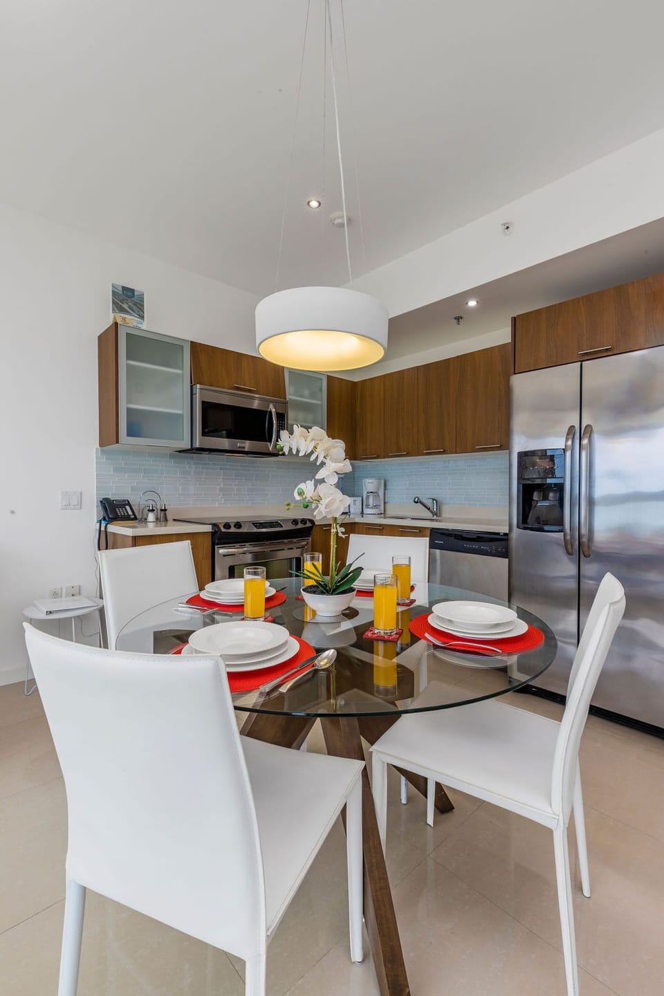 Your fully equipped kitchen and dining area offers sleek stainless appliances and contemporary design, perfect for preparing meals and enjoying breakfast together in comfort.