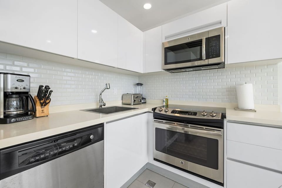Your sleek, modern kitchen comes fully equipped with stainless-steel appliances, perfect for preparing meals in style and comfort.