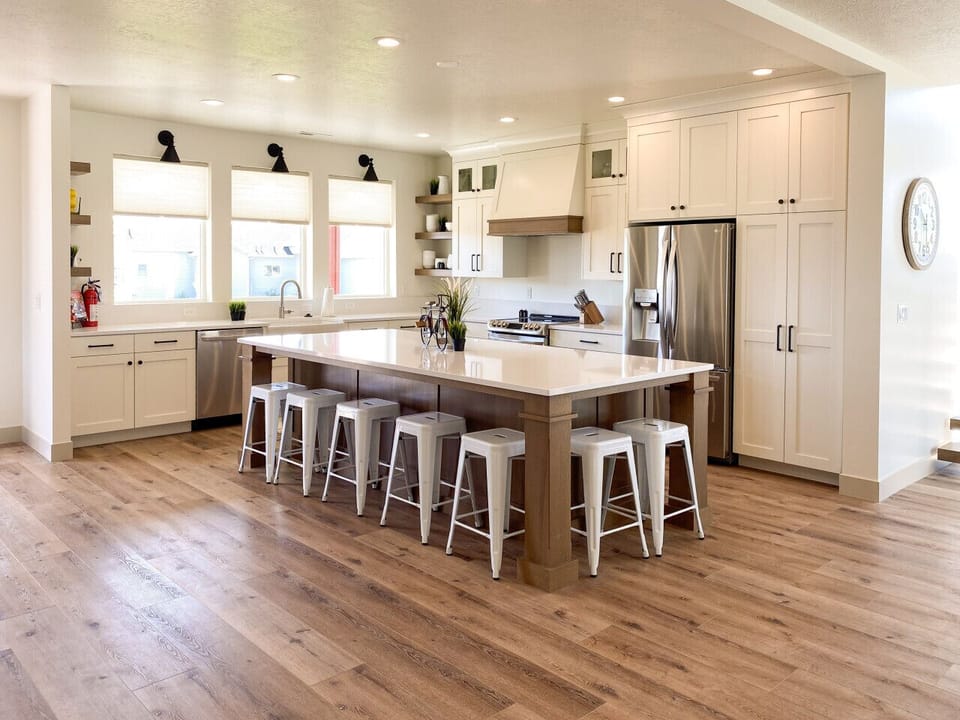 Bright, modern kitchen with spacious island—perfect for meals, laughter, and gathering with loved ones.