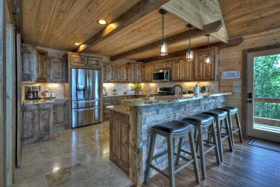 Fully equipped kitchen with stainless steel appliances and granite countertops