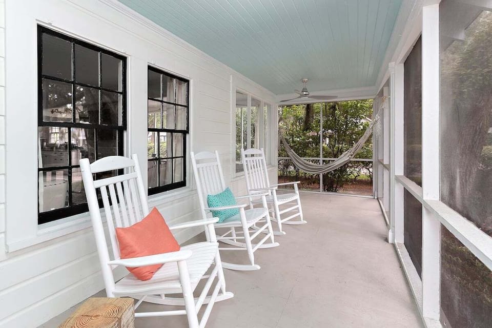 Covered porch with rocking chairs and blue ceiling