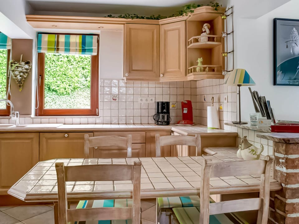 Villa | Private kitchen | Fridge, highchair