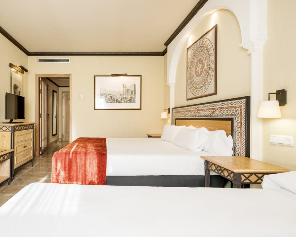 Triple Room | Minibar, in-room safe, desk, soundproofing