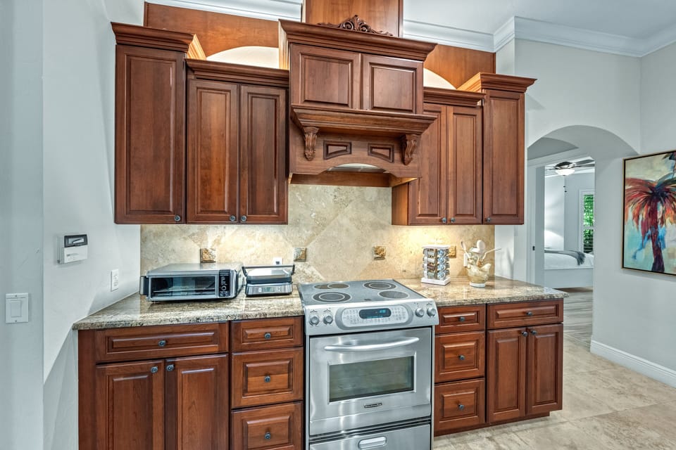 A thoughtfully stocked kitchen featuring a state-of-the-art panini press, perfect for easy lunches or quick bites between outings.