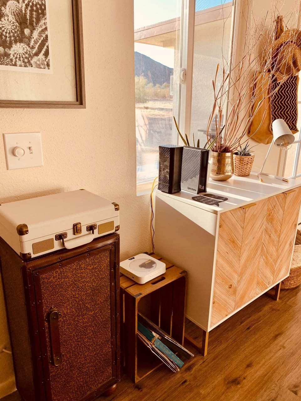 Crosely record player and CD player. Games can be found inside the cabinet.