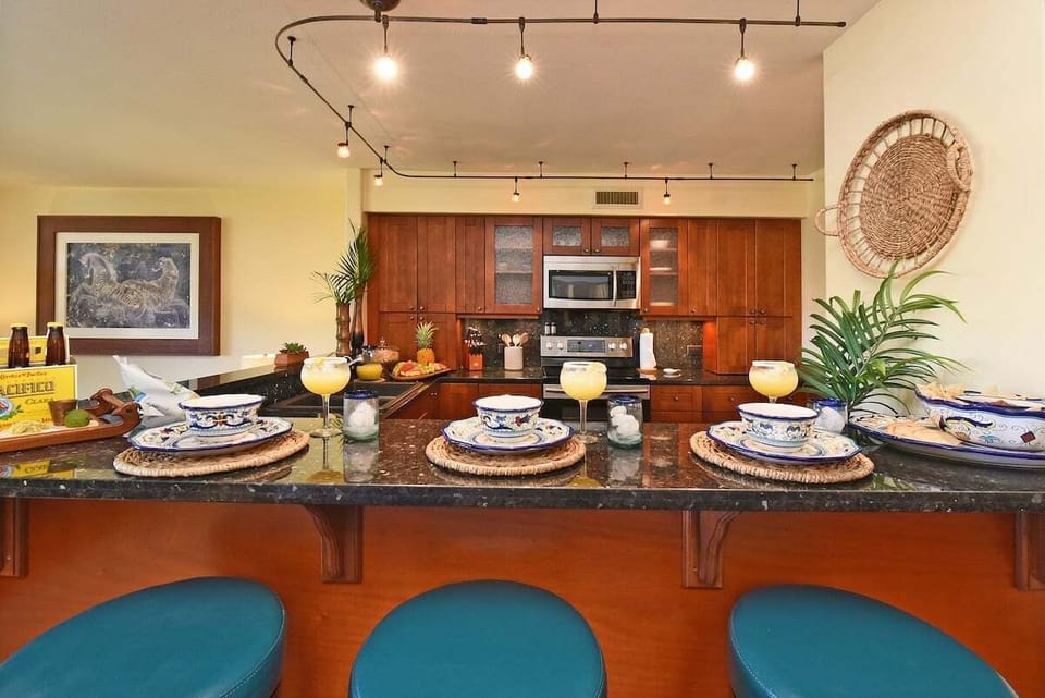 Enjoy a bright kitchen with stainless steel appliances and warm wood cabinetry