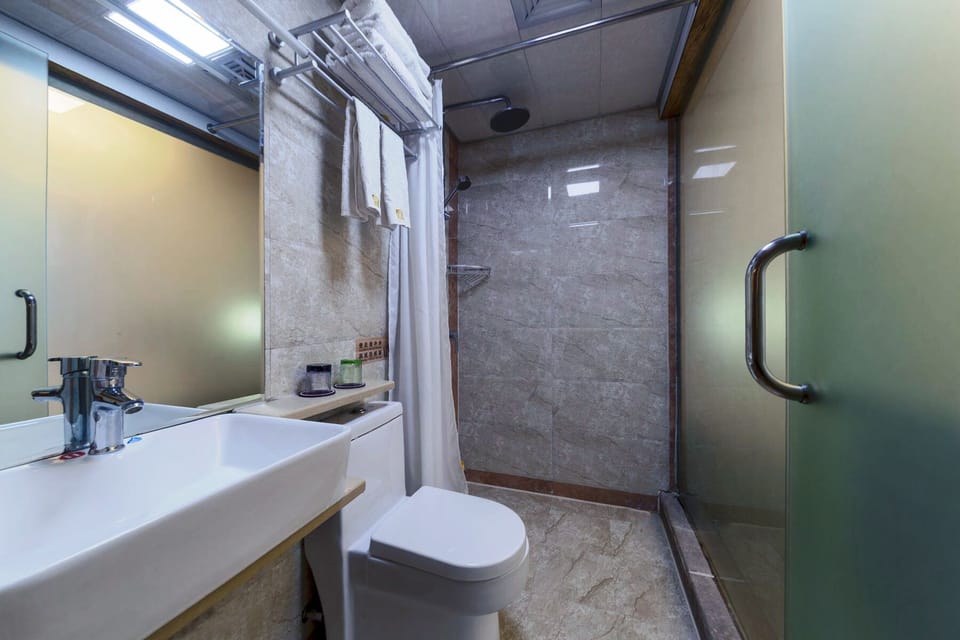 Shower, hair dryer, slippers, towels
