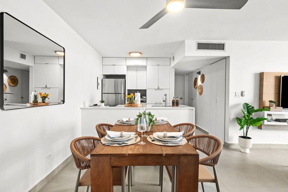 A bright, modern dinning area with comfortable seating for the whole group