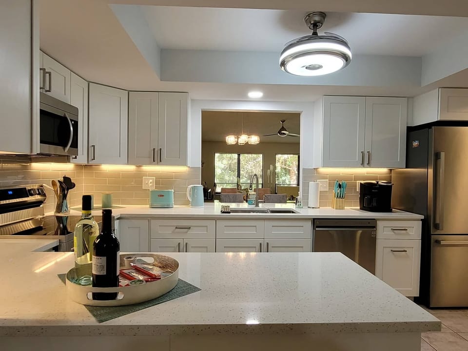 Kitchen with a view into the Living Room and Private, Luscious Background...