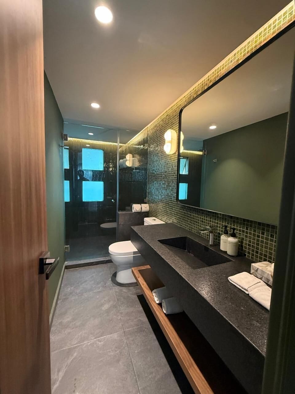Shower, designer toiletries, hair dryer, bathrobes