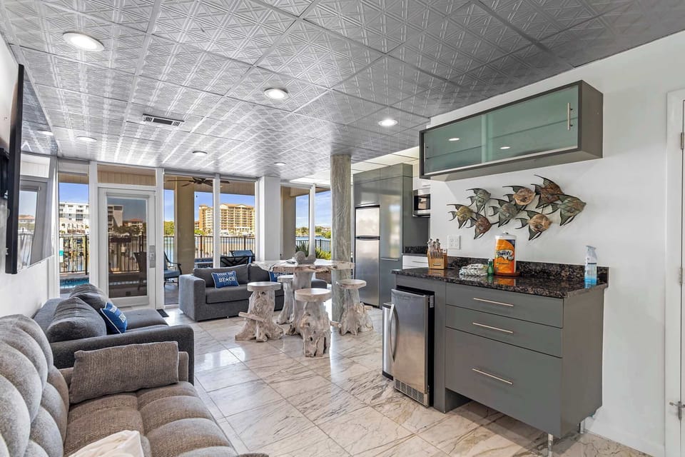 Open living space w/ tile floors, comfy seating, & a relaxed coastal vibe.