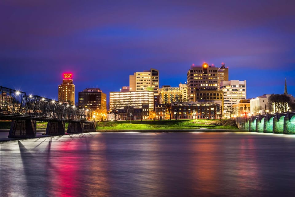 Enjoy sparkling riverfront city views as downtown lights up after dark