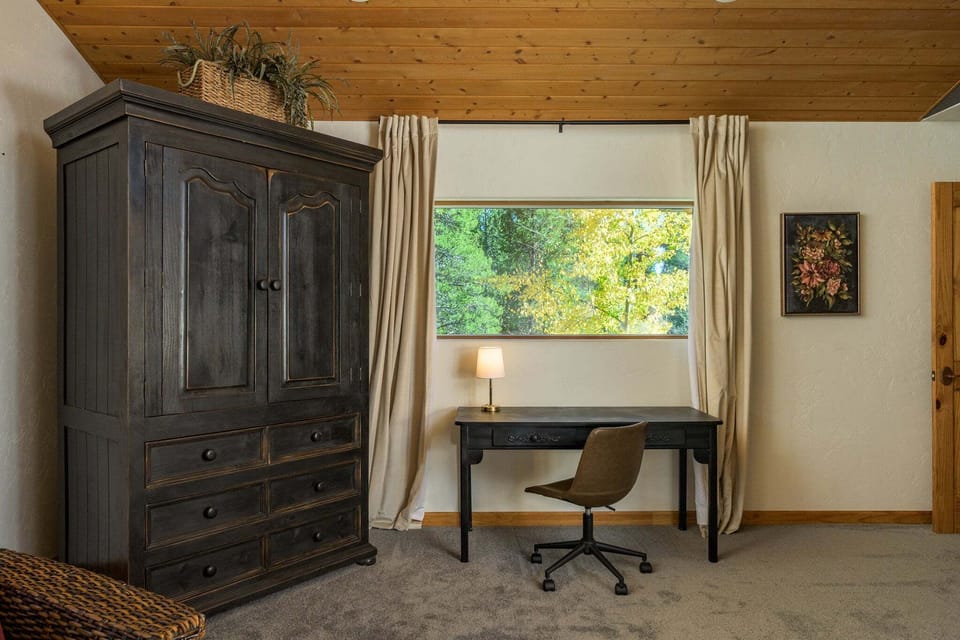 Work with a View — A desk overlooking the woods—remote work never looked so peaceful. 🌲💻
