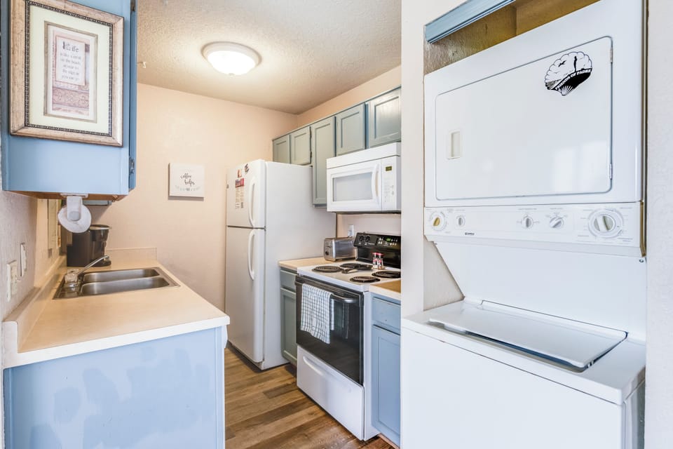 Your fully equipped kitchen features everything you need, plus convenient in-unit washer and dryer for effortless laundry during your stay.