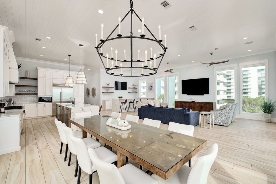 Your spacious open-plan living awaits with soaring ceilings, elegant lighting, and seamless flow from kitchen to dining to relaxation areas.