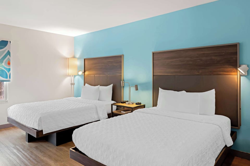 Desk, laptop workspace, blackout drapes, iron/ironing board