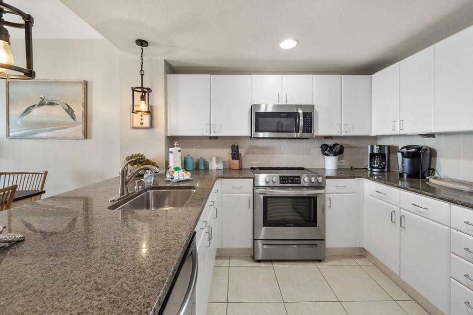 Your fully equipped kitchen awaits with granite counters, stainless appliances, and everything needed for memorable meals during your stay.