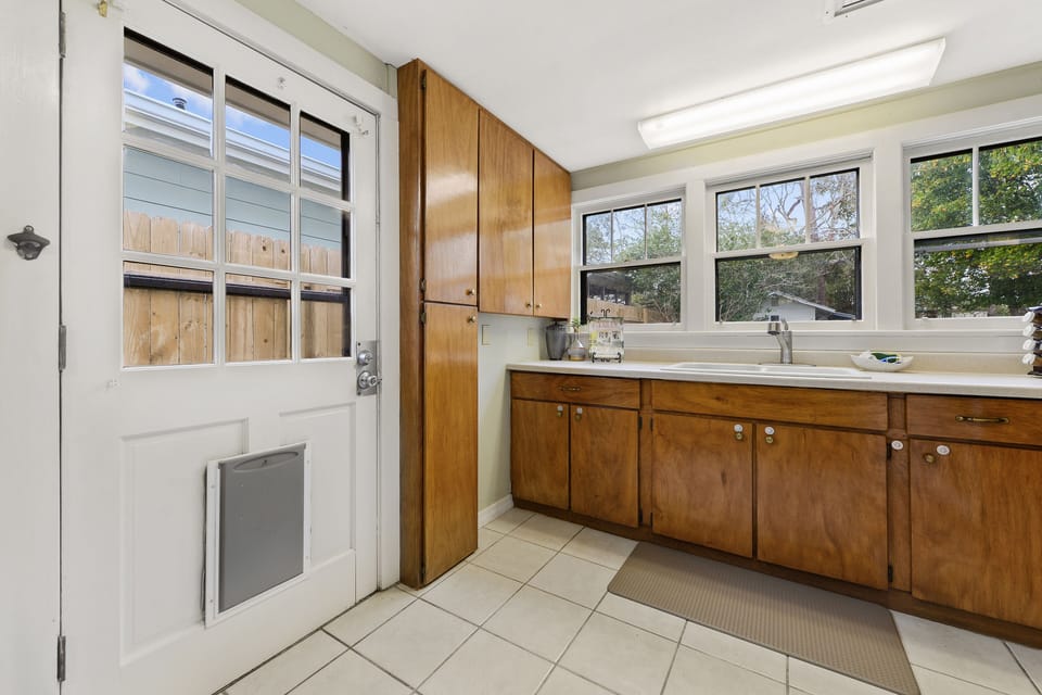 Backyard door with doggie door to fenced in back yard 