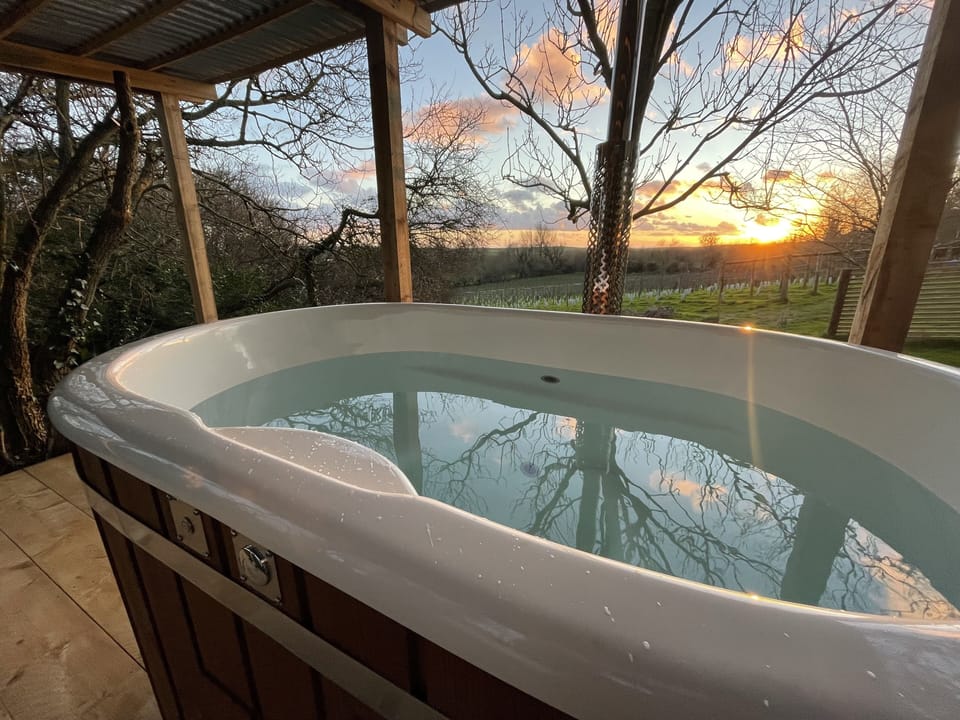 The Wood Fired Hot tub and an evening sunset!
