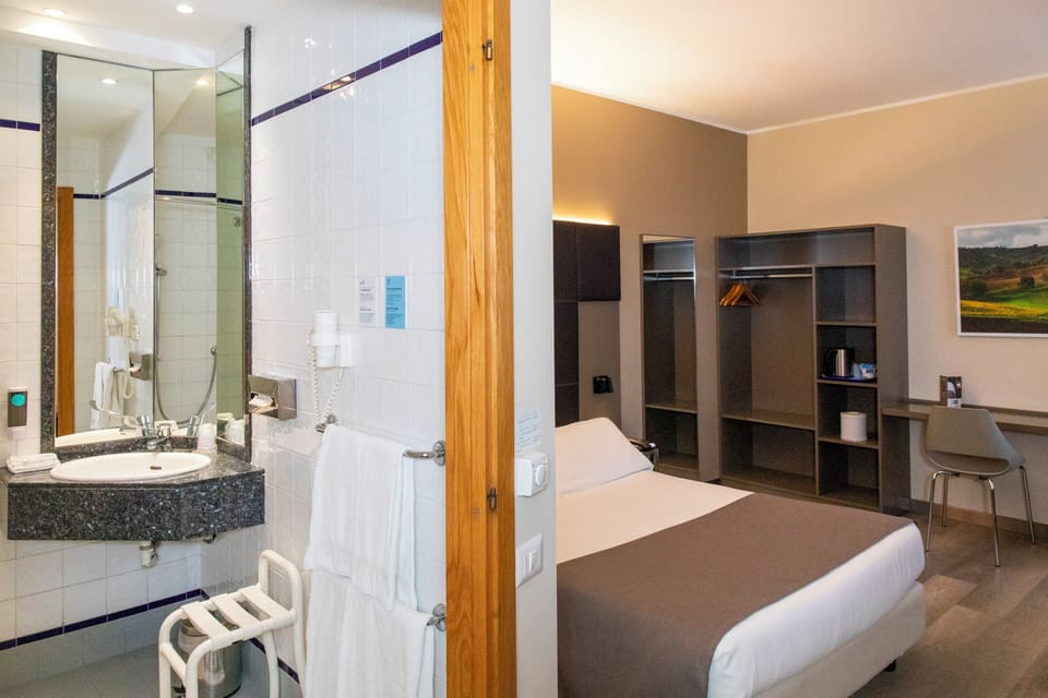 Superior Room, Mobility Accessible | Minibar, desk, laptop workspace, blackout drapes