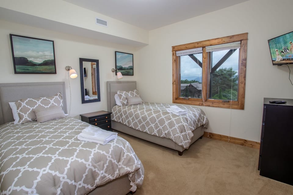 Lower Level Twin Bedroom with View Window and HDTV