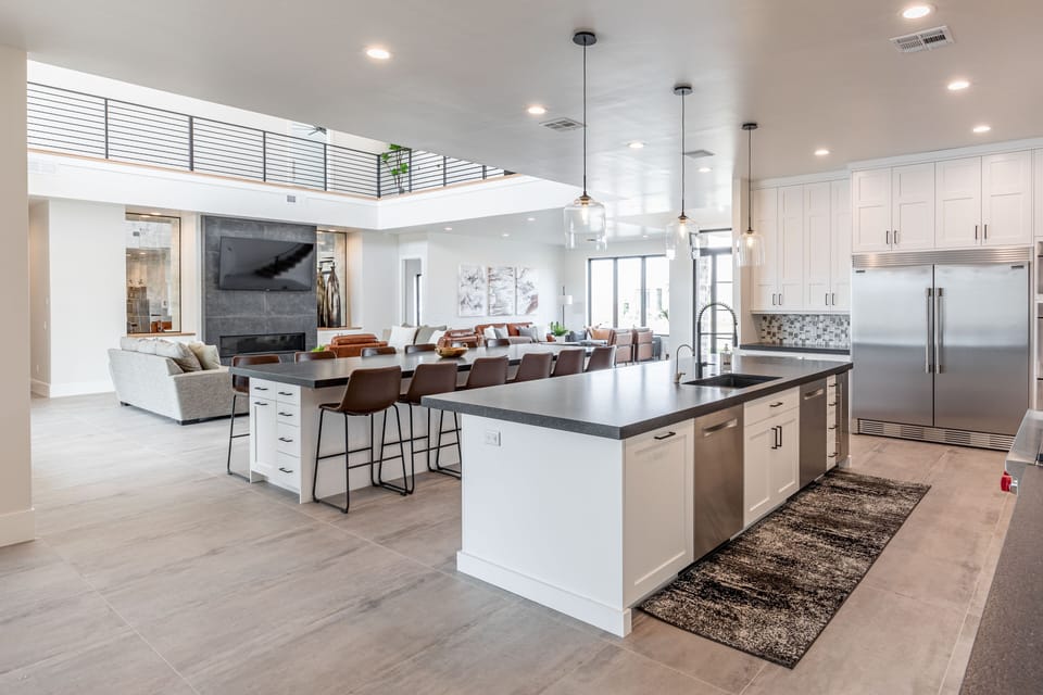 Kitchen - This kitchen has two full fridges and plenty of seating for all of your guests.  The second island seats 12 and includes storage for two 8 foot tables for additional seating.