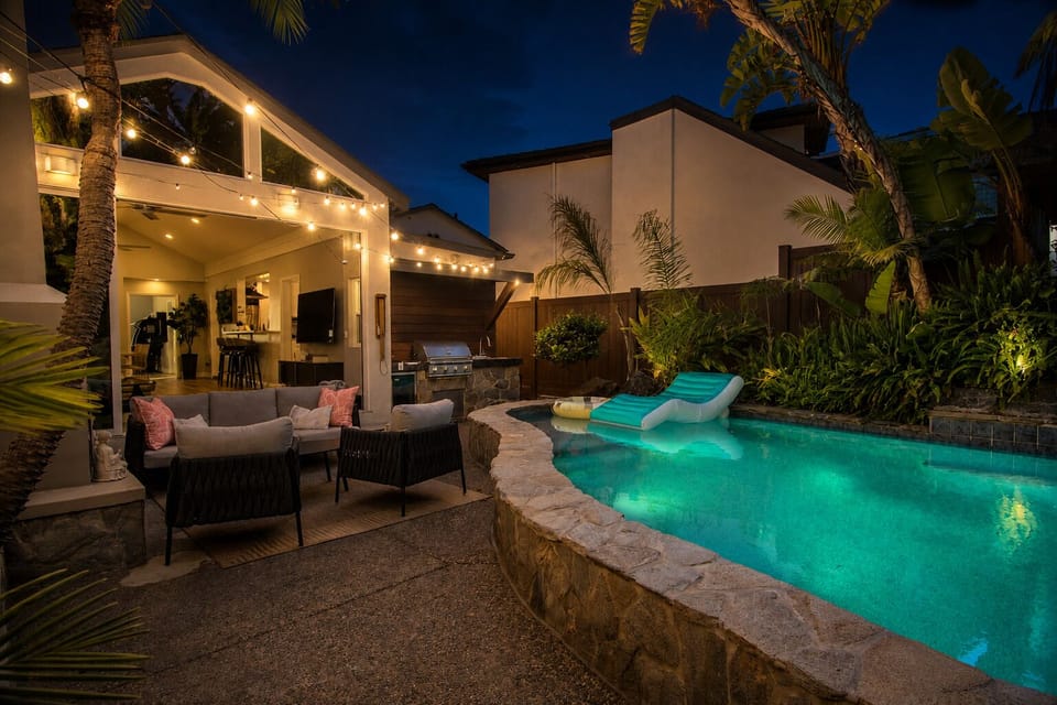 Enjoy peaceful evenings by the pool under the string lights.