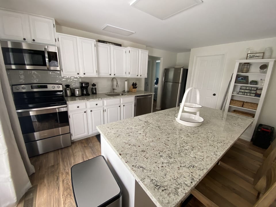 Newly updated kitchen with brand new granite countertops and appliances.   