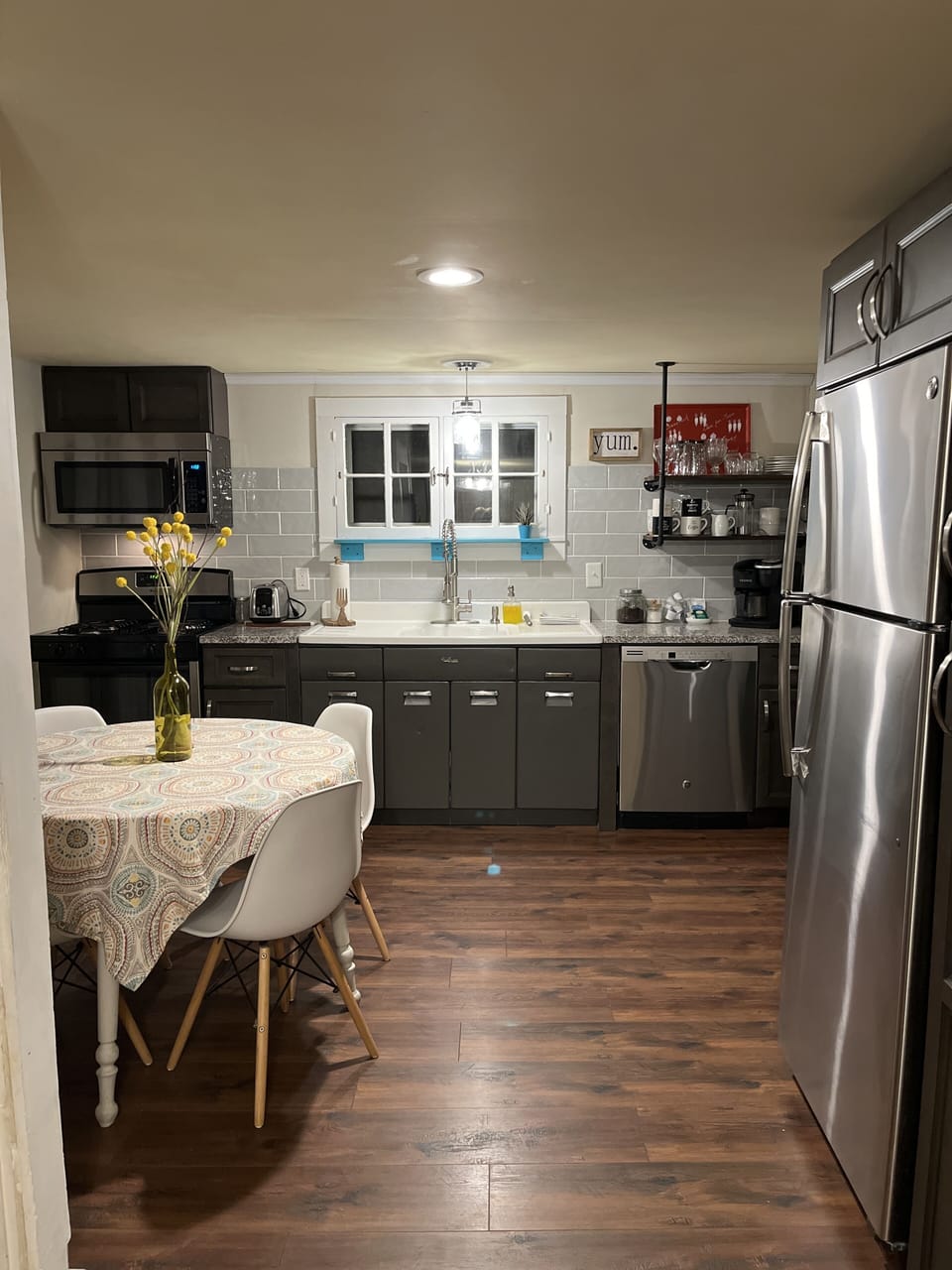Fully stocked kitchen: pots, pans, dishes , cups , glasses, utensils.