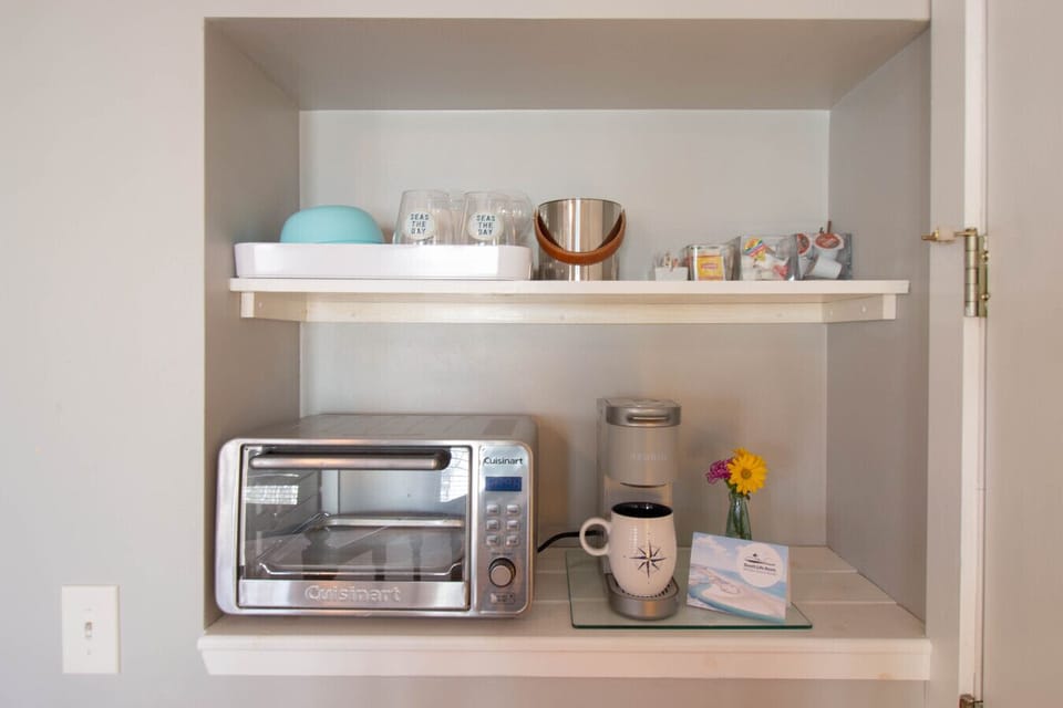Dedicated coffee station, toaster oven, and some dishes.