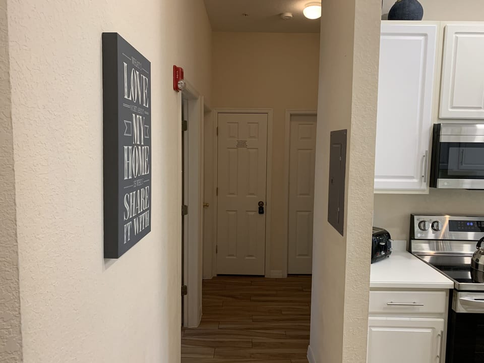 Hallway to Bedroom 2,3, Full Bath, Kitchen, & Laundry