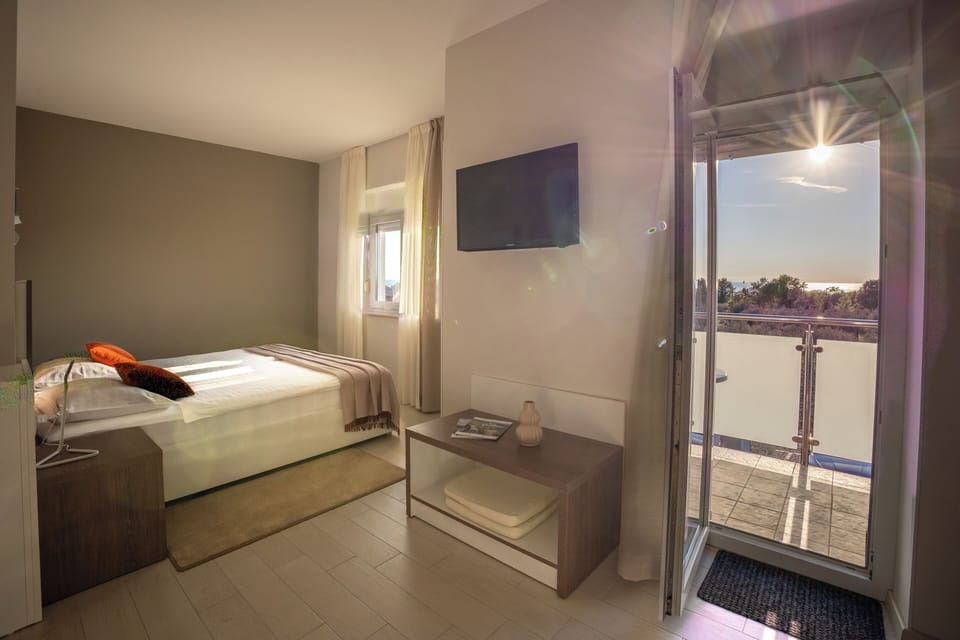 Superior Double Room, Balcony, Partial Sea View | In-room safe, desk, free WiFi, bed sheets