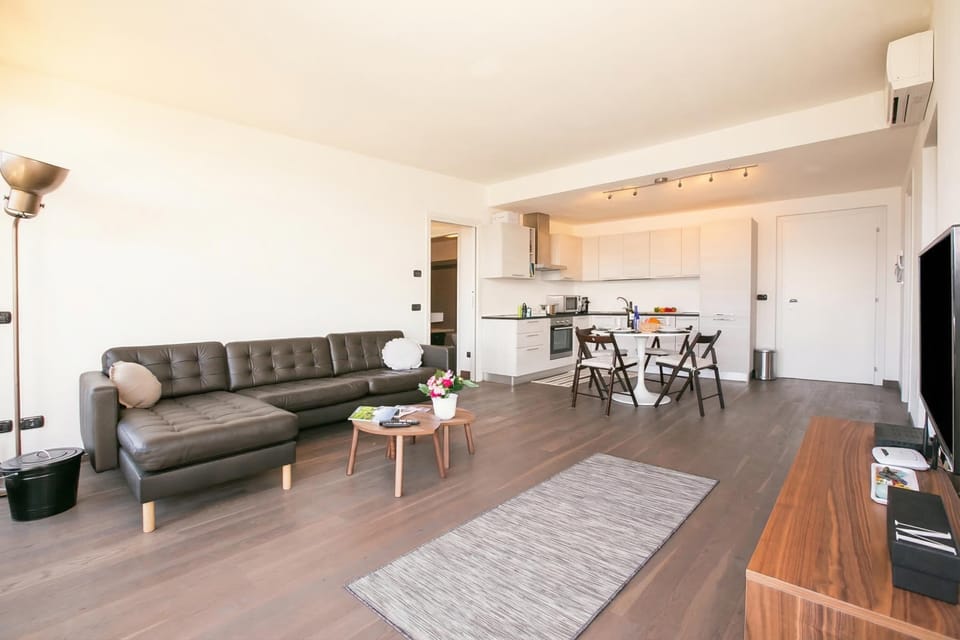 Family Apartment, Multiple Bedrooms, Mountainside (Penthouse-LakeView-AC-PrivateGarden) | Living room | 21-inch flat-screen TV with digital channels, TV, heated floors
