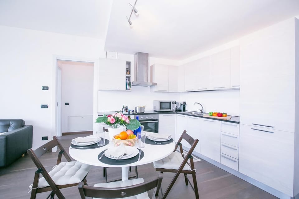 Family Apartment, Multiple Bedrooms, Mountainside (Penthouse-LakeView-AC-PrivateGarden) | Private kitchen | Fridge, microwave, oven, stovetop
