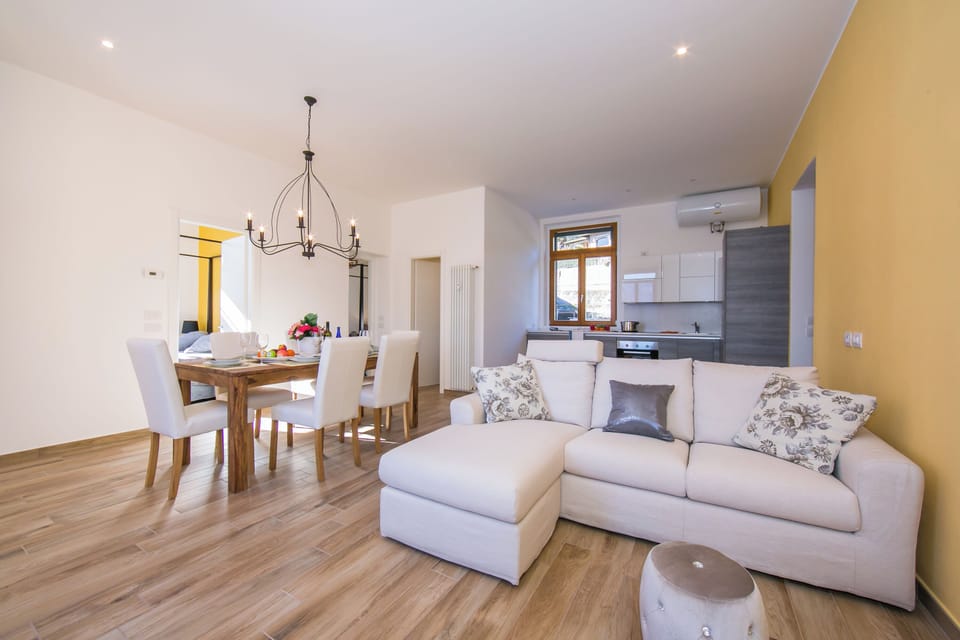 Family Apartment, Multiple Bedrooms, 2 Bathrooms, Lakeside (Villa Evelyn Terrazzo) | Living area | 24-inch flat-screen TV with digital channels, TV, heated floors