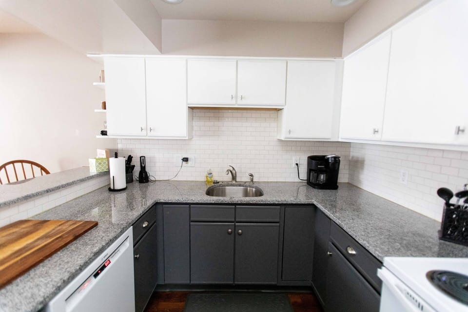 Kitchen with all appliances, Coffee Maker, dishes, cups, plates, pots and pans.