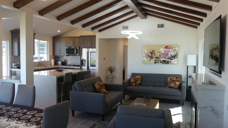 Modern Living room with Bay View , Bar and Dining room with Bay View  with HDTV 
