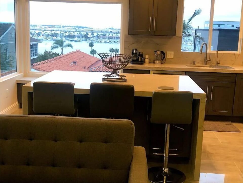 Modern large Kitchen island and countertops with vanishing edge 