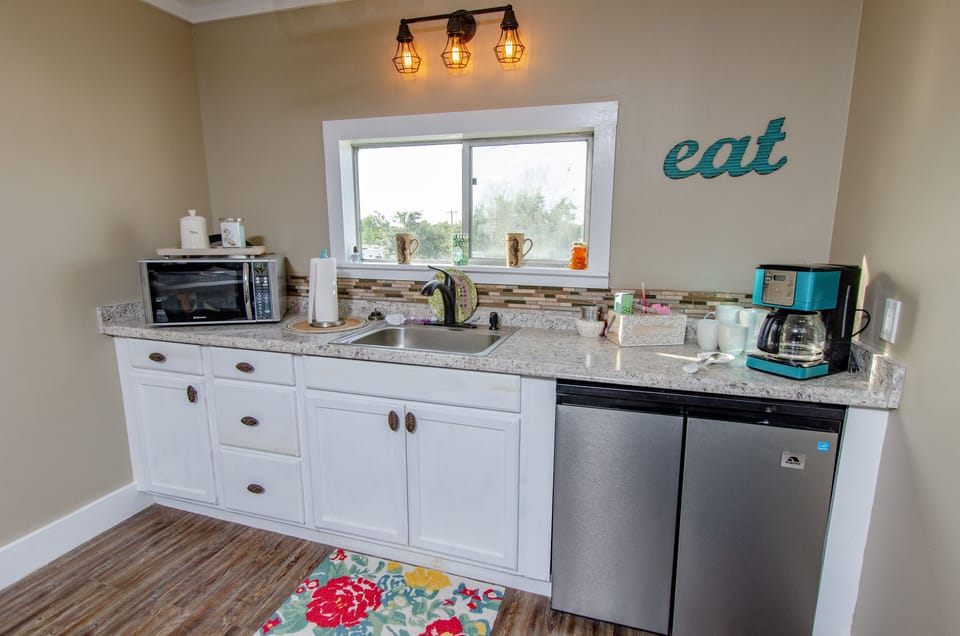 2nd kitchen with fridge, microwave and another coffee maker