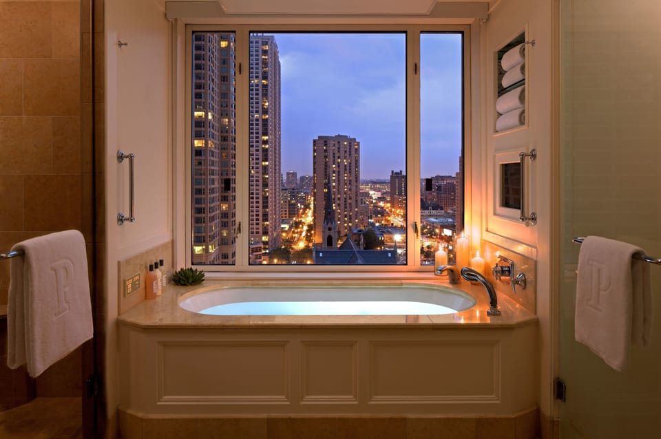 Separate tub and shower, designer toiletries, hair dryer, bathrobes