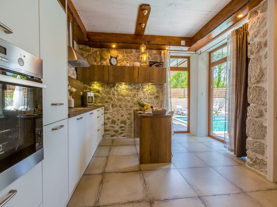 Villa | Private kitchen | Fridge, microwave, oven, stovetop