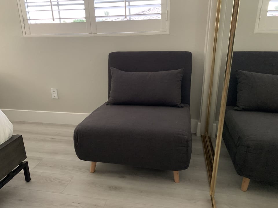 Room with the queen bed has a comfortable single sofa bed that fully opens up.
