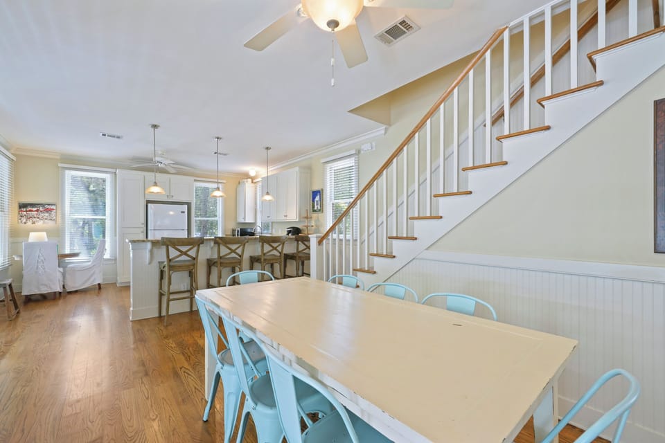 DINING FACING KITCHEN AND STAIRCASE LEADING TO SECOND LEVEL
