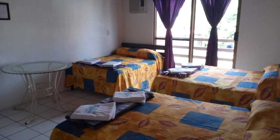 Family Triple Room | Desk, bed sheets