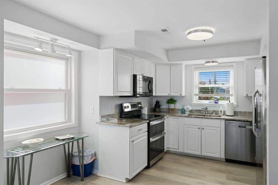 Kitchen Bliss: Modern appliances and bright windows invite culinary adventures! Enjoy!