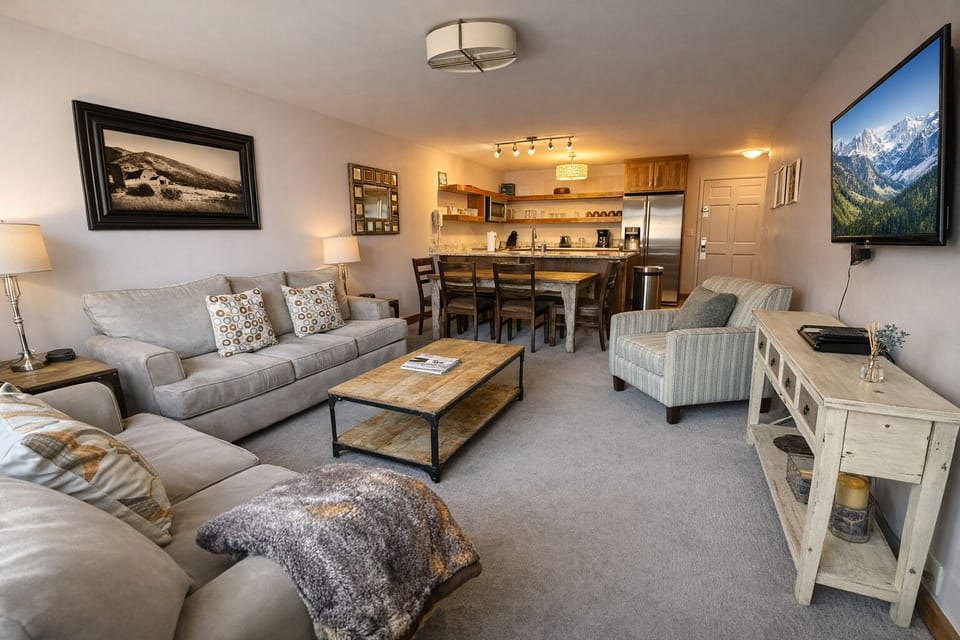 Relax in the inviting living area featuring comfortable seating and an open layout that's perfect for reconnecting after a day of skiing or exploring Park City.