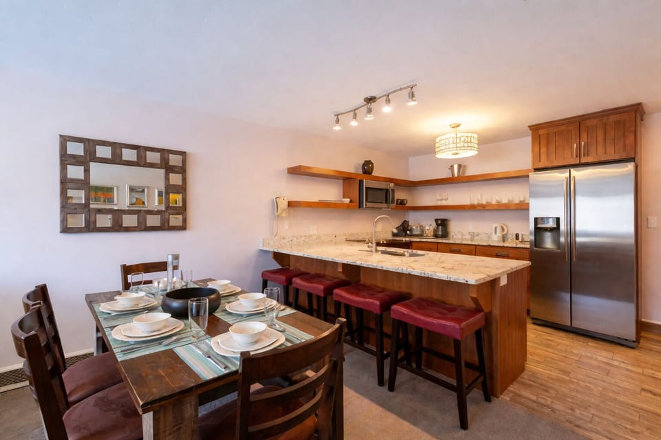 Share meals together at the dining table and oversized breakfast bar, offering plenty of seating for family and friends.
