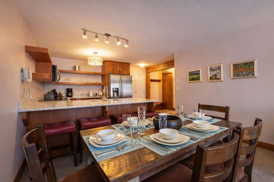 The open-concept kitchen and dining area make it easy to prepare meals while staying connected with your group.